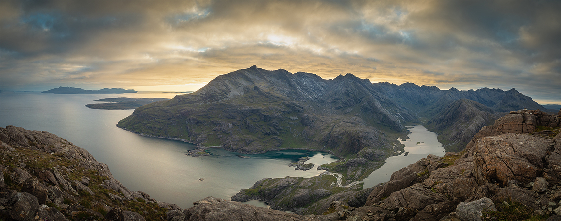 A shot from up high of the Cuillin Mountains, Skye, with evening light behind